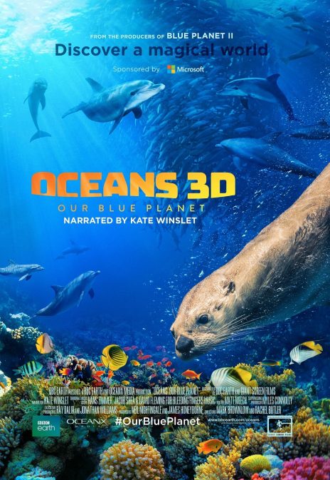 A poster for Oceans 3D: Our Blue Planet. A marine life scene of a coral reef with an otter in the foreground, and dolphins and various schools of fish in the background. There is text that reads: "From the producers of BLUE PLANET 2. Discover a magical world. Sponsored by Microsoft. Oceans 3D: Our Blue Planet, Narrated by Kate Winslet."