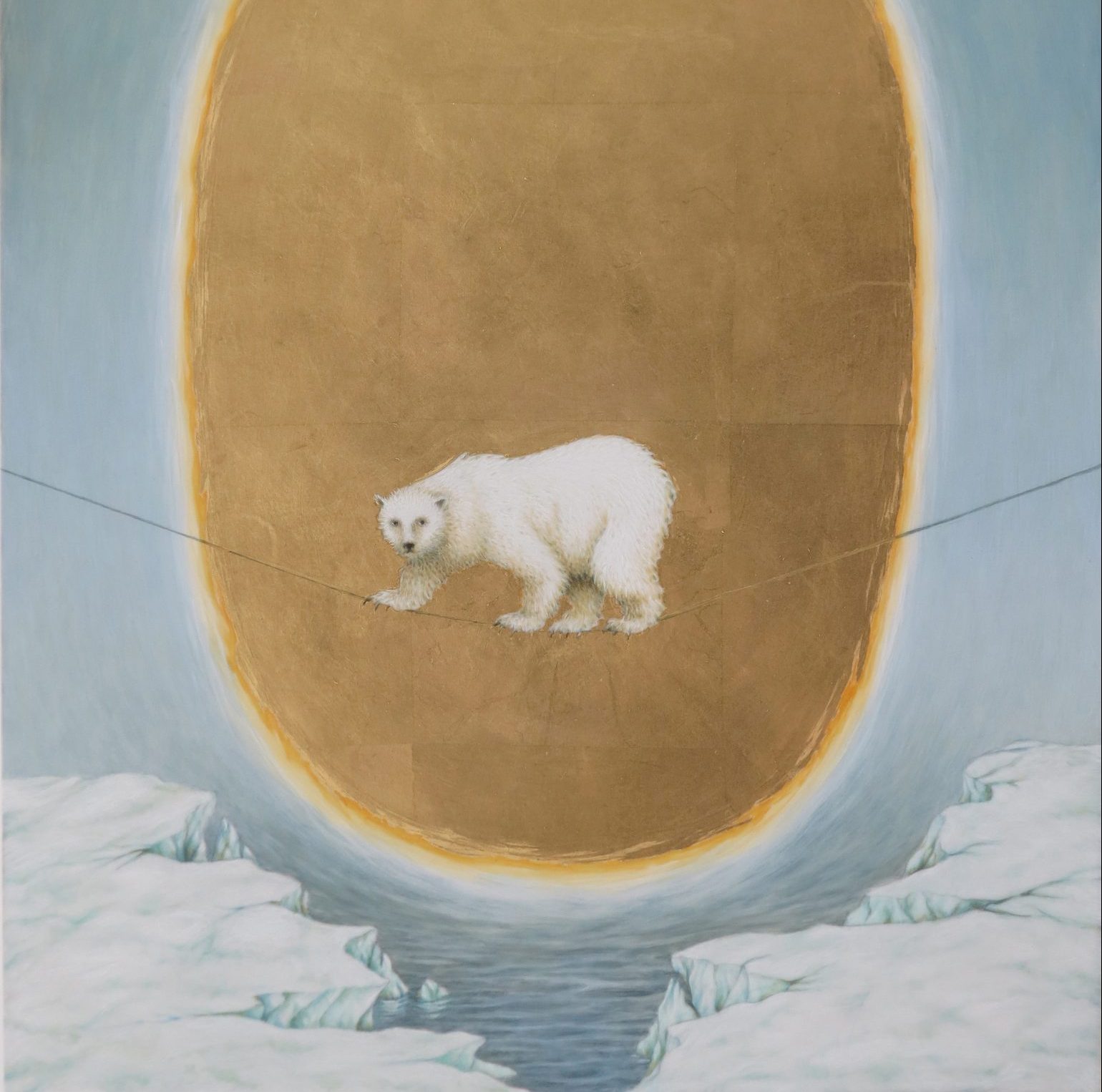 A drawing of a polar bear walking on a tightrope. There are ice caps in the water in the background.