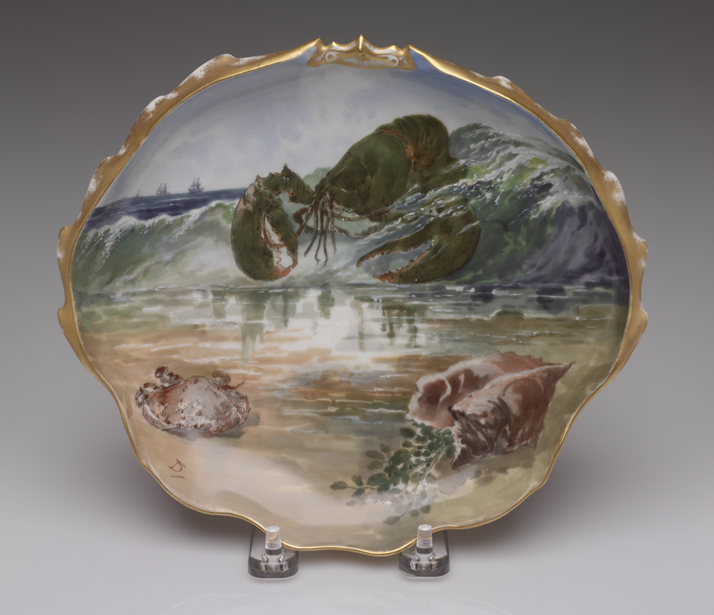 A porcelain and enamel seafood-themed plate.