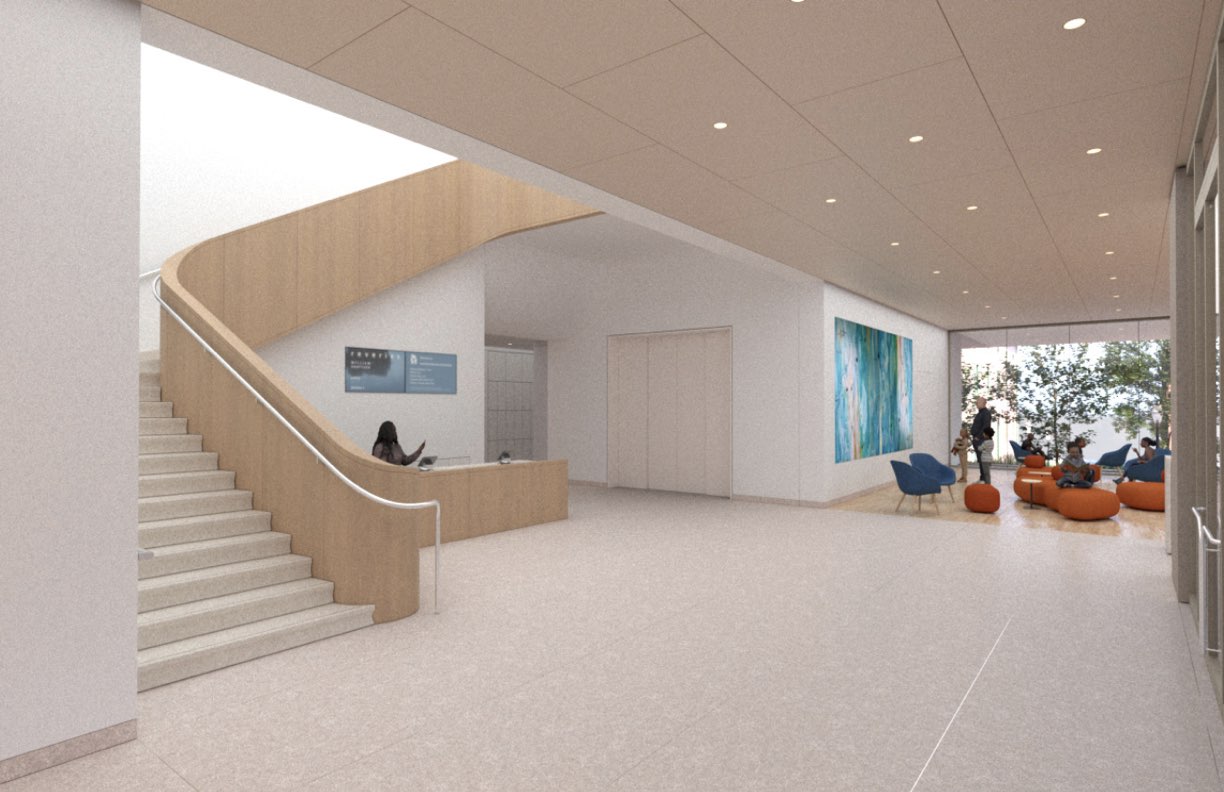 Update_Apprentices_03062025.010 Modern museum lobby with curved staircase, reception desk, seating area, and large colorful artwork.