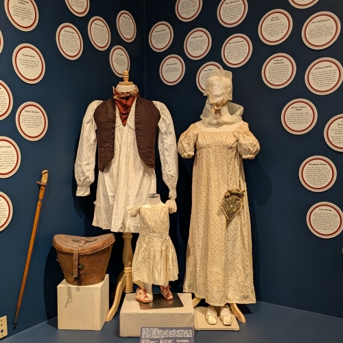 Mannequins of clothing from the early 1800s.